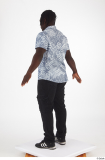 Kato Abimbo black jeans black sneakers casual dressed short sleeve…